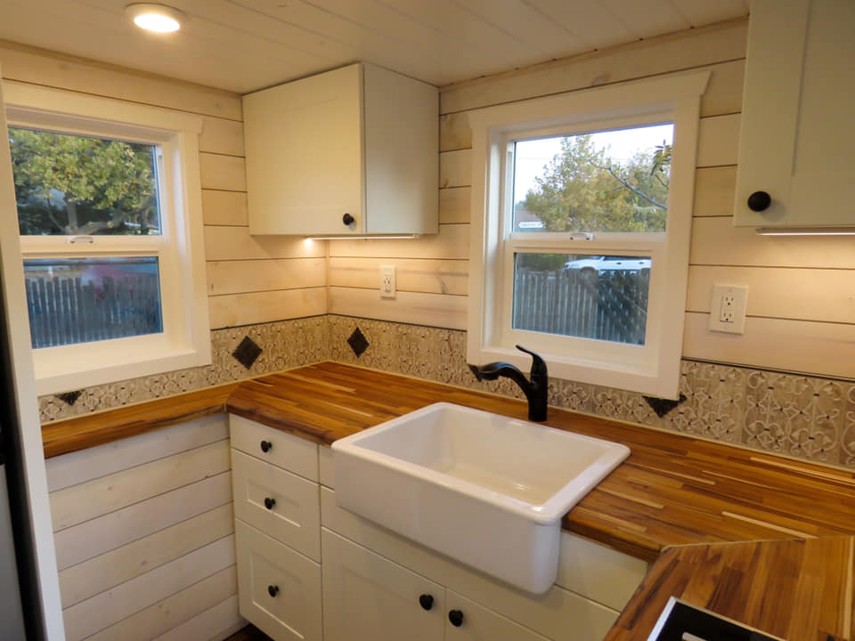 Tiny home kitchen with farmhouse sink and wood countertops